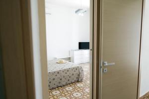 Televízia a/alebo spoločenská miestnosť v ubytovaní Sole Mare - Casa Vacanze Chiavarello