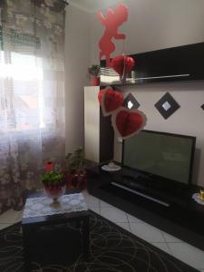TV a/nebo společenská místnost v ubytování Nido delle meraviglie