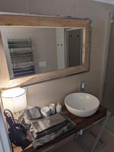 a bathroom with a sink and a mirror at EXCELSIOR 10 - Luxury apartment in Grado