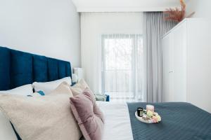 Łóżko lub łóżka w pokoju w obiekcie Lake Club Apartments - LoftAffair
