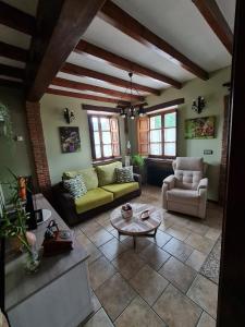 a living room with a couch and a table at La Torruca in Oreña