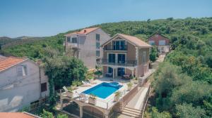 an aerial view of a house with a swimming pool at Villa Tivat in Tivat
