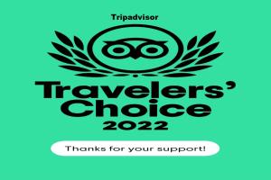 a sticker with the words travellers choice thanks for your support at Leconfield House in Greta
