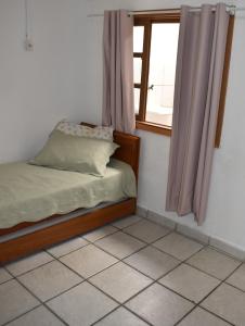 Cama o camas de una habitación en Kitnet Itapema