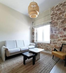 a living room with a couch and a table at Apartman Noa in Široki Brijeg