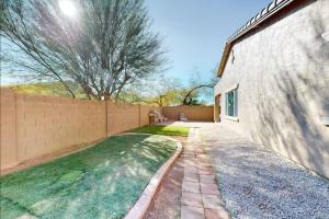 a backyard of a house with a fence at NEW! Stunning Peaceful Peoria Home - Very Close to Sports Complex in Peoria