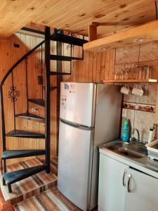 Kuchyň nebo kuchyňský kout v ubytování PUNTA DE TRALCA SUITES + 10 fotografií