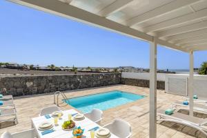 The swimming pool at or close to Villa Muzu by Villa Plus