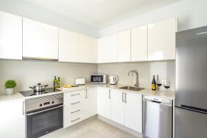 A kitchen or kitchenette at Villa Muzu by Villa Plus