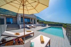 The swimming pool at or close to Villa Katoikia Mia by Villa Plus