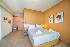 A bed or beds in a room at Villa Katoikia Mia by Villa Plus