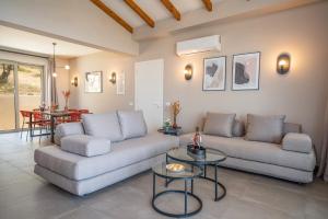 A seating area at Villa Katoikia Mia by Villa Plus