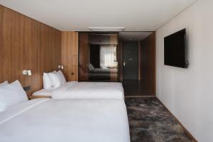 Postel nebo postele na pokoji v ubytování Hotel tt Gupo
