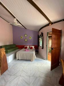 a bedroom with a bed and a table in a room at Pousada Encontro de Rios in Lençóis