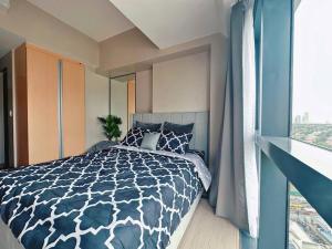 Säng eller sängar i ett rum på Eastwood High Life - Spectacular City View