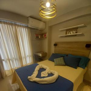 Ένα ή περισσότερα κρεβάτια σε δωμάτιο στο Zafiro Barrio Norte by Citrino Aparts