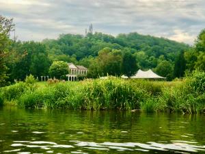 a view of a river with a house in the background at Chattanooga Room at Tennessee RiverPlace in Chattanooga