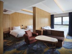 Postel nebo postele na pokoji v ubytování Hotel tt Gupo