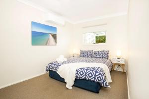 Ένα ή περισσότερα κρεβάτια σε δωμάτιο στο Hayes Beach House I Award Winner I 4 Mins to Beach