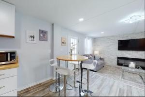 a living room with a table and a couch at Blue Oasis in the Hill Country in Kerrville