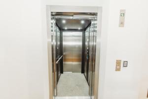 a hallway with a elevator in a building at The Albion Hotel in Cootamundra