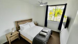 Postel nebo postele na pokoji v ubytování Swell Resort Burleigh Heads
