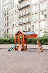 a playground with a play structure and a slide at Sky Coyoacan Depto con terraza privada in Mexico City
