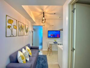 A television and/or entertainment centre at Nordic Inspired Corner Unit in Azure Urban Resort 1700 Residences