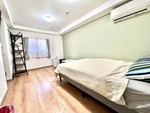 Letto o letti in una camera di 難波無印ノ家