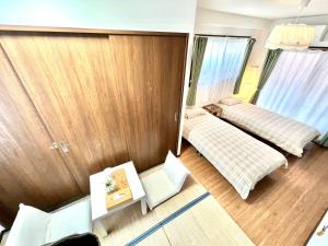 Letto o letti in una camera di 難波無印ノ家