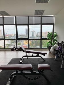 a gym with two exercise bikes and a large window at Golden Oceanview at Icon Residence in Kuala Terengganu