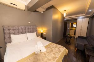 Postel nebo postele na pokoji v ubytování Cumbali Luxury Boutique Hotel