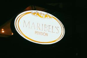 ein Schild für eine marlleeds Person in einem Restaurant in der Unterkunft Maribel’s Pension Sindangan in Sindangan
