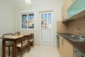 Kuchyňa alebo kuchynka v ubytovaní Blanco Apartment by A&D Properties + 14 fotografií