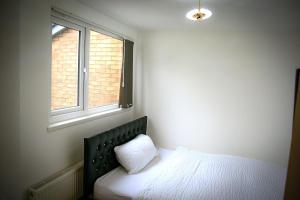 Postel nebo postele na pokoji v ubytování Rostron House