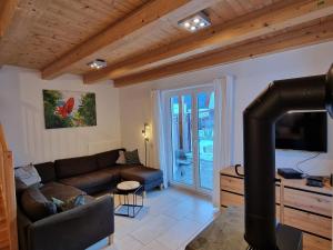 A television and/or entertainment centre at Chalet in Kötschach by Ski Slopes