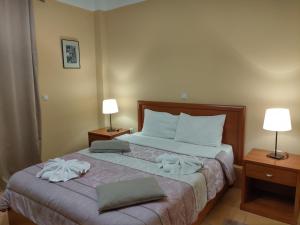 Postel nebo postele na pokoji v ubytování Guesthouse Lithos