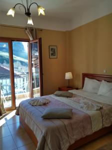 Postel nebo postele na pokoji v ubytování Guesthouse Lithos