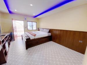 Tempat tidur dalam kamar di Doithinnan Resort