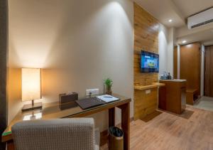 TV a/nebo společenská místnost v ubytování Hotel Cachar Club