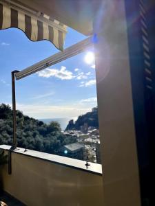 a window with a view of a city at La Ca Dei Nonni in Monterosso al Mare