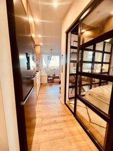 a hallway with a bunk bed and a room with a bedroom at Boutique lux design apartment @Bansko Royal Towers in Bansko +60 photos
