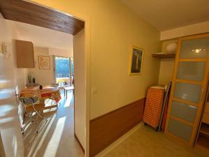 a kitchen and dining room with a table in a room at les goelands in Saint-Georges-de-Didonne