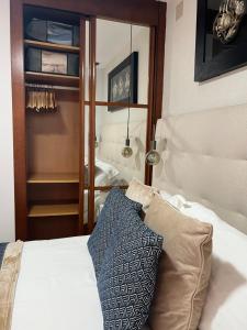 Łóżko lub łóżka w pokoju w obiekcie Apartamento Nemingzhen Tarifa