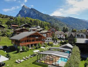 an aerial view of a resort with a mountain in the background at Logis Hotel Gai Soleil in Samoëns