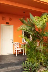a porch of a house with a white door at The Room Padang-Padang in Uluwatu