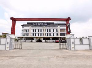 a large white building with a sign on it at DZ Hotel Salor in Kota Bharu