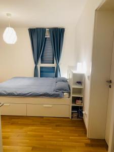 a bedroom with a bed with a window at brauHAUS in Forchheim