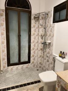 a bathroom with a shower and a toilet and a sink at 103/24 Kathu Waterfall in Phuket Town +17 photos