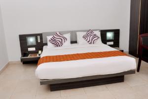 Posteľ alebo postele v izbe v ubytovaní Hotel Palm shore